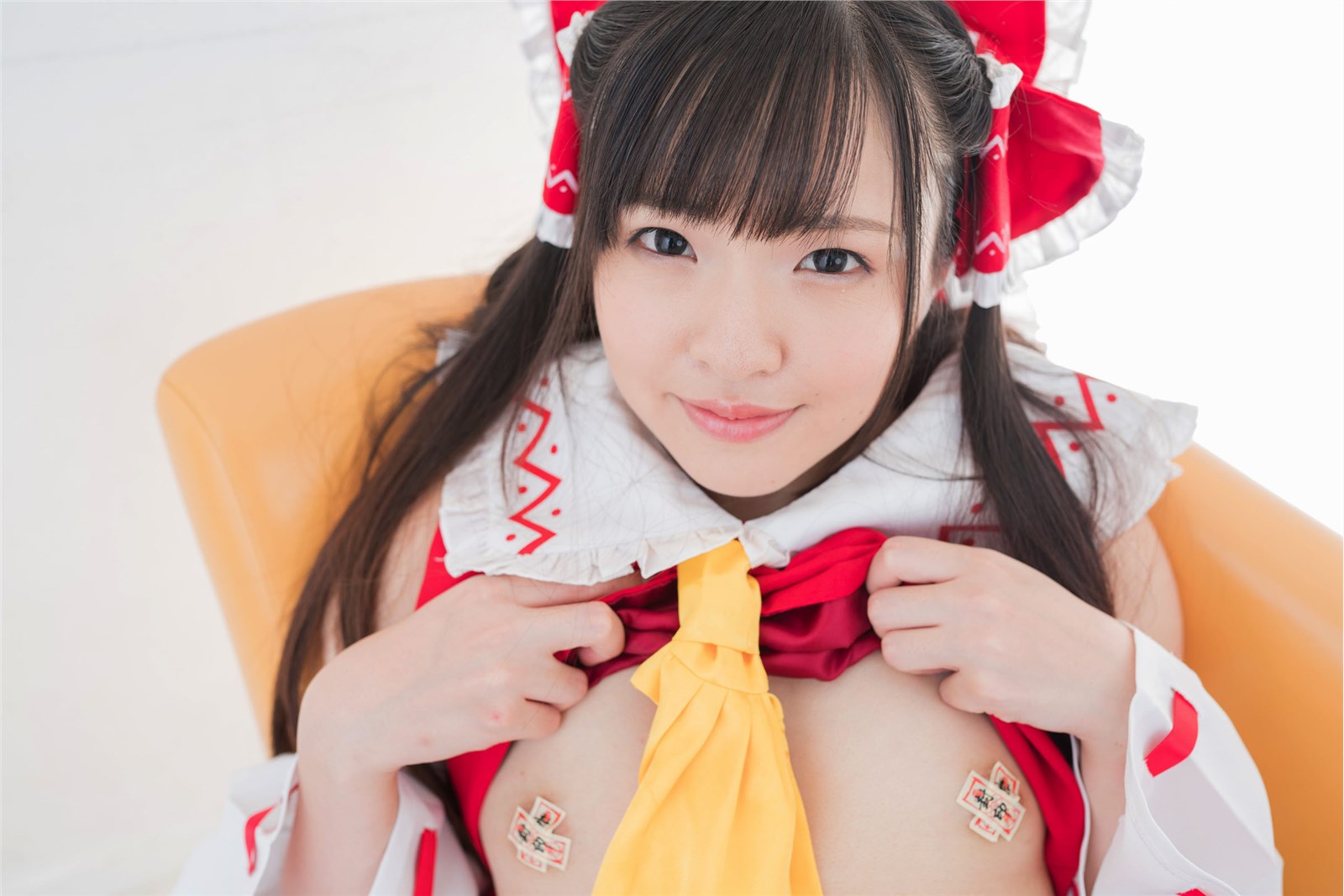 The attractive Japanese cosplayer slightly reveals her flat chest(24)