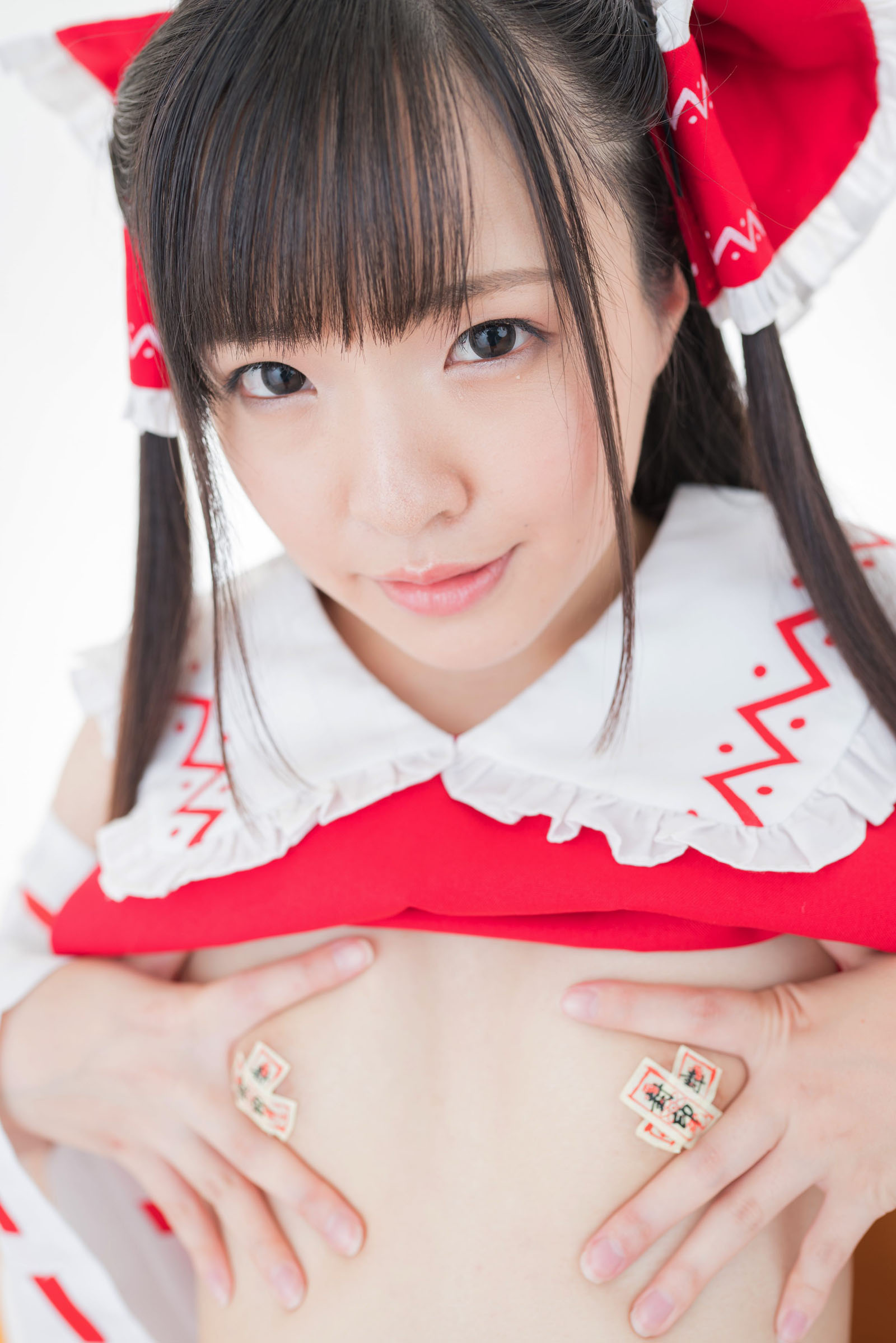 The attractive Japanese cosplayer slightly reveals her flat chest(53)